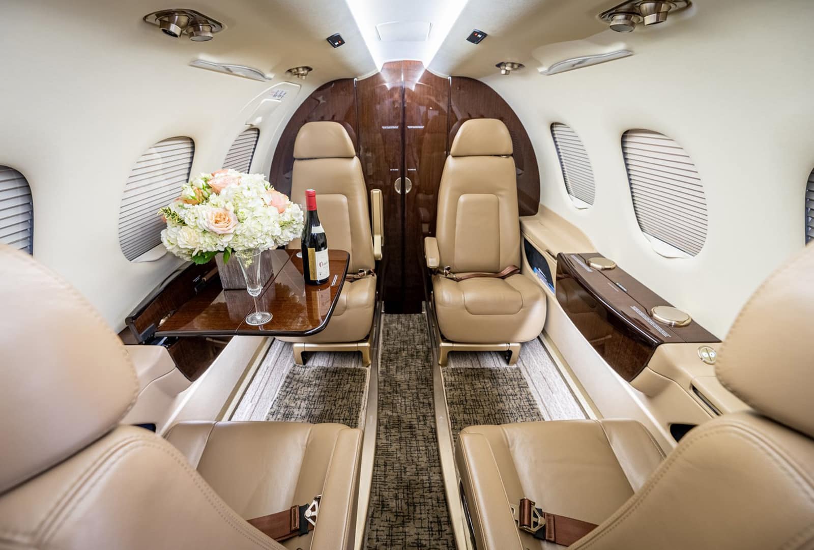 https://www.flyair7.com/wp-content/uploads/2024/03/Embraer_Phenom_interior-2.jpg?utm_source=chatgpt.com